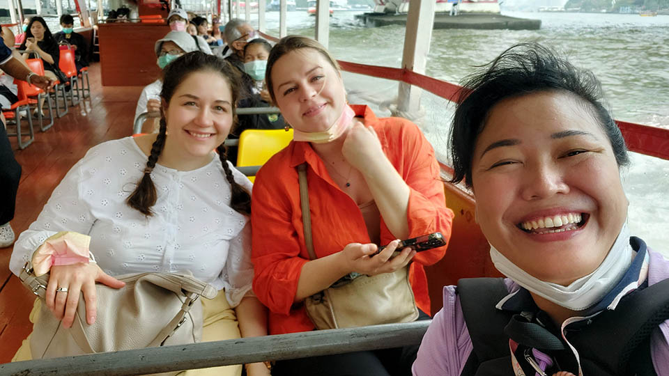 Lalita O. and friends with Bangkok tour guide Apple enjoying a scenic Chao Phraya River boat ride
