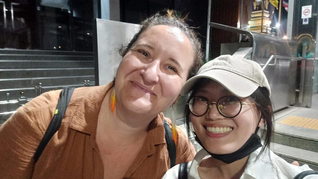 Rebecca G. with Bangkok tour guide Ticha enjoying an evening sightseeing tour in Thailand
